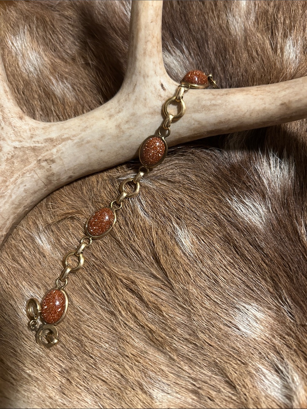 12k gold fill antique amco link bracelet with eye catching stone.